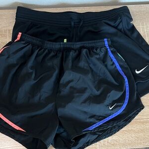 2 Nike Women's Black Shorts with Blue and Pink Accents
